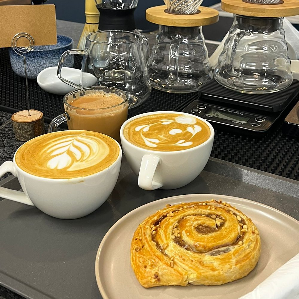 Lattes, karak and a pastry on the brew bar