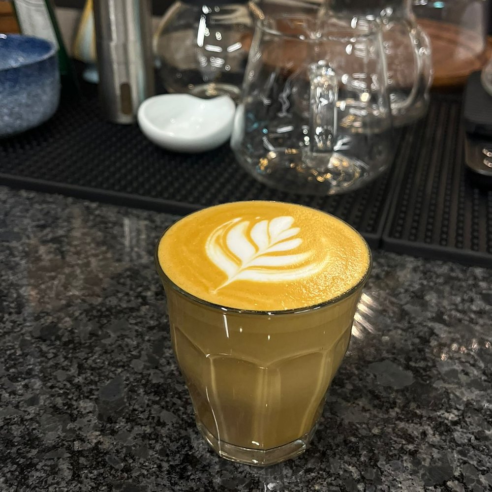 Golden latte with rosetta art