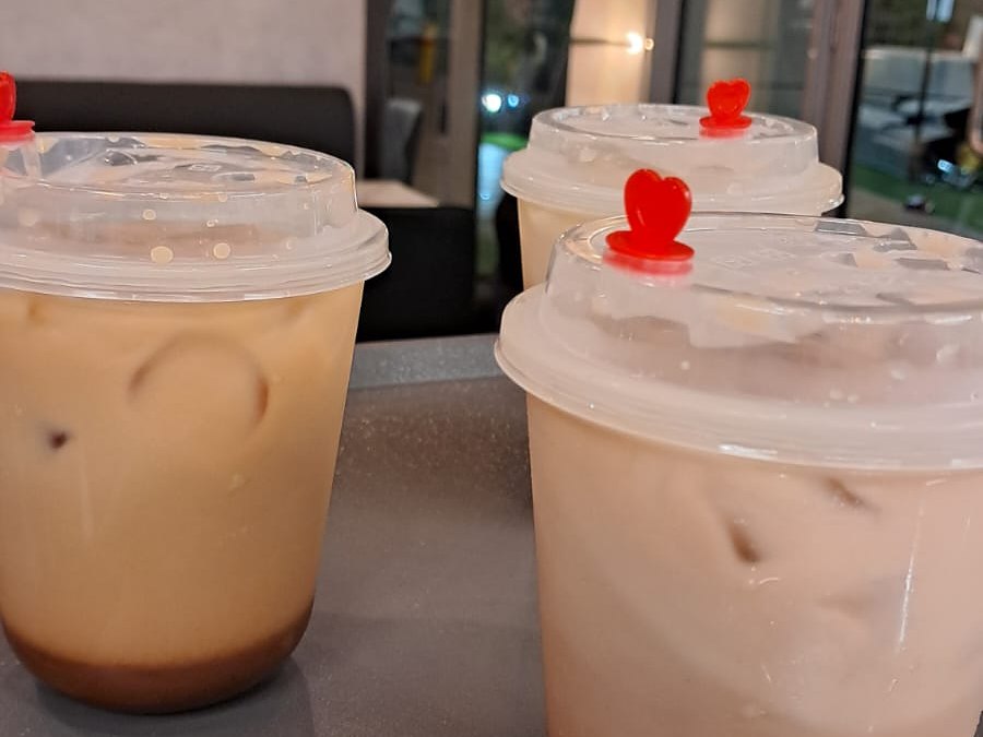 Three iced karaks with red heart stoppers at Karak Junction