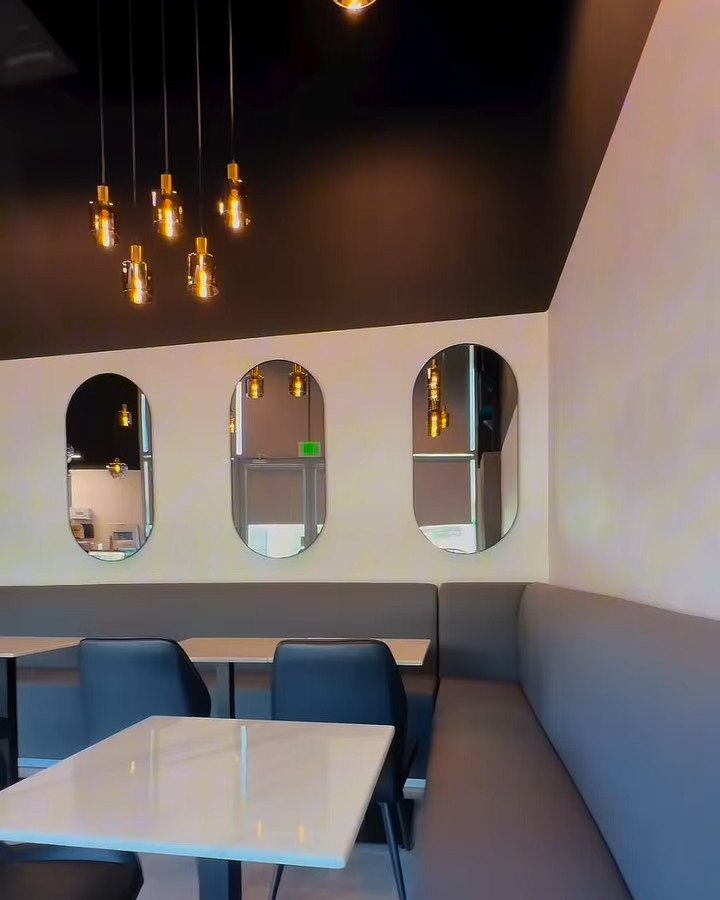 Inside Karak Junction at SkyCourts — arched niches, pendant lights, and cosy seating
