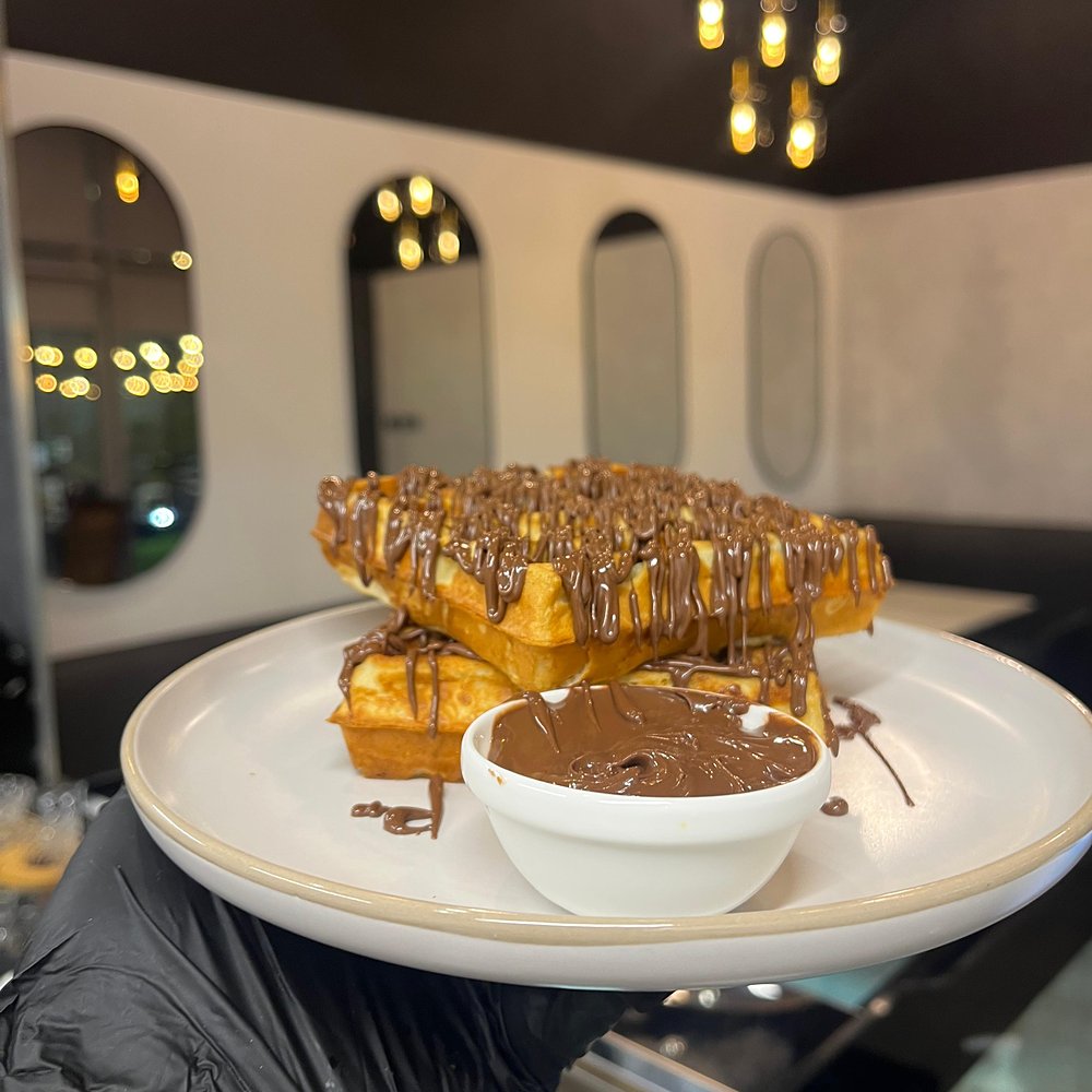 Waffles with chocolate drizzle and dipping bowl